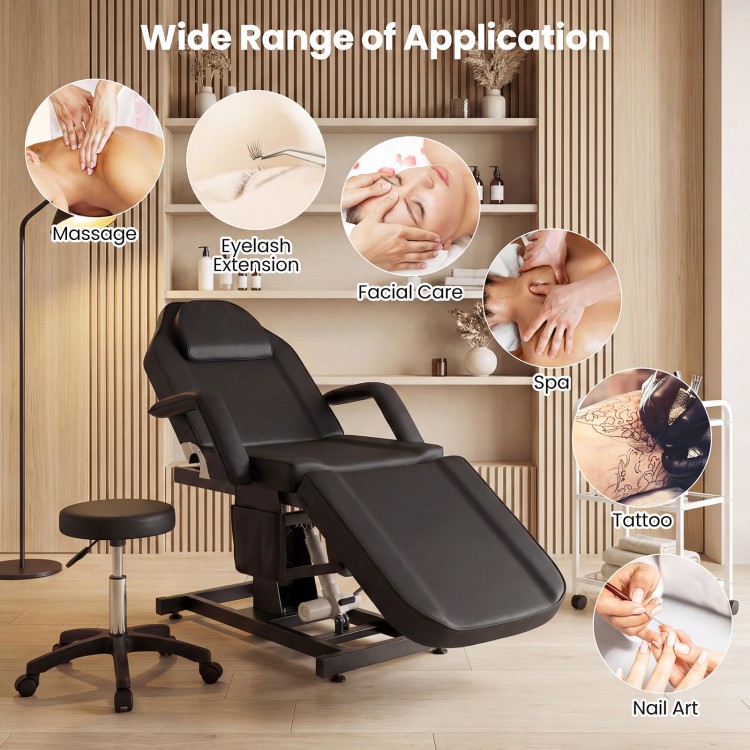 Tattoo chair in black with adjustable backrest and footrest, ideal for estheticians in spa and beauty settings.