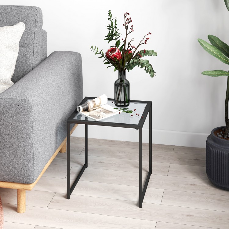 Square tempered glass side table with a sleek metal frame, perfect for displaying decor in indoor and outdoor spaces.