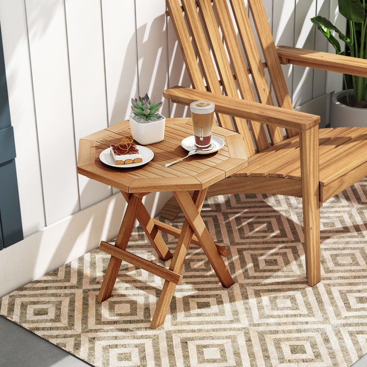 Teak wood octagon coffee table with slatted tabletop and X-shaped legs, perfect for outdoor use and easy storage.