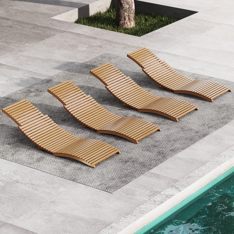 Four teak wood patio folding chaise lounge chairs with slatted seats, perfect for poolside relaxation and outdoor.