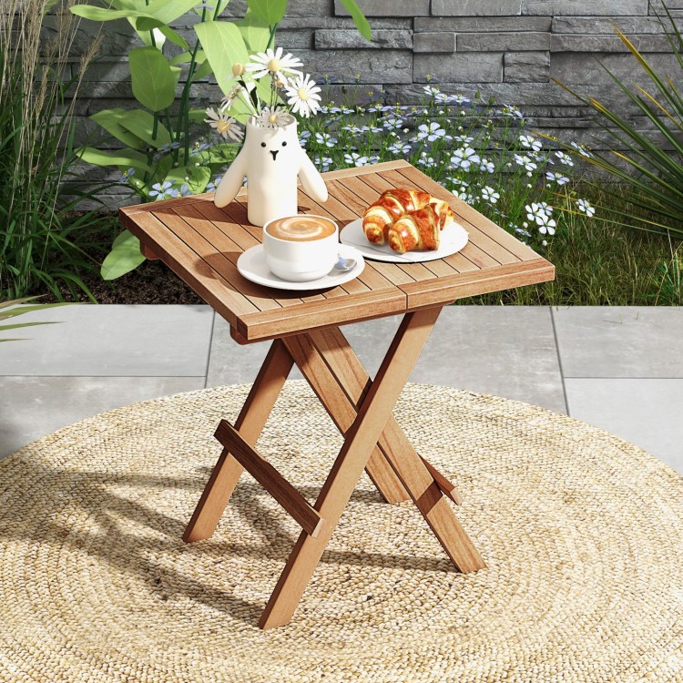 Teak wood square coffee table with slatted tabletop, X-shaped legs, perfect for outdoor picnics and backyard use.