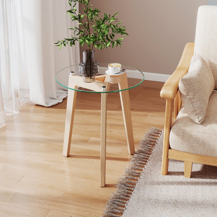 Round tempered glass end table with solid rubber wood legs, ideal for living room or bedside use.