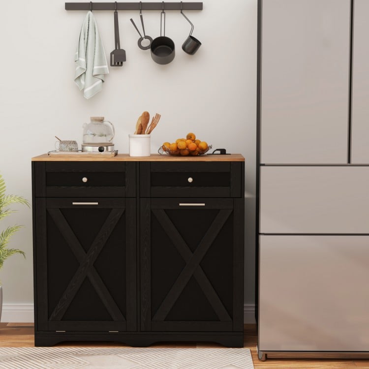 Tilt Out Trash Can Cabinet in black with a wooden countertop, featuring drawers, shelves, and built-in power outlets.