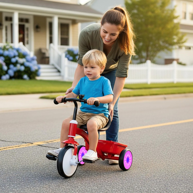 Toddler tricycle with glowing wheels, adjustable seat, and rear storage bin, perfect for outdoor playtime.