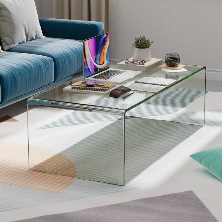 Clear tempered glass coffee table with rounded edges, measuring 40 x 19.5 x 13.5 inches, ideal for living room use.