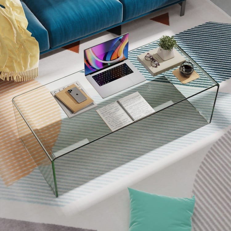 Glass coffee table with rounded edges, 40 x 19.5 x 13.5 inches, ideal for living room decor and easy cleaning.