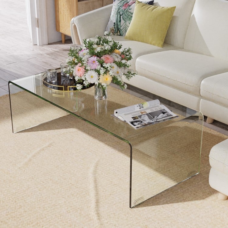 Glass coffee table with rounded edges, 40 x 19.5 x 13.5 inches, perfect for a clean and elegant living room setup.