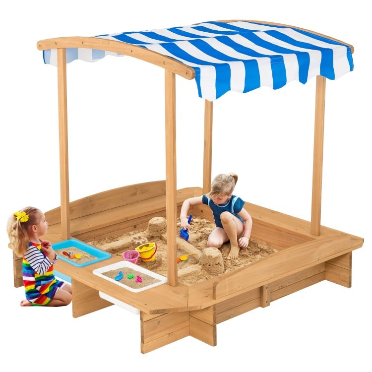 Kids wooden sandbox with striped canopy, made of solid cedar wood, featuring seating and sand/water play bins for.
