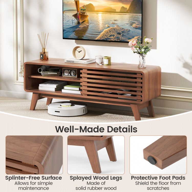Brown TV stand for TVs up to 55" featuring a sliding door, adjustable shelves, and splayed rubber wood legs.