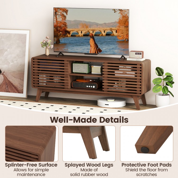 Walnut TV stand for TVs up to 65", featuring sliding doors, adjustable shelves, and splayed rubber wood legs.