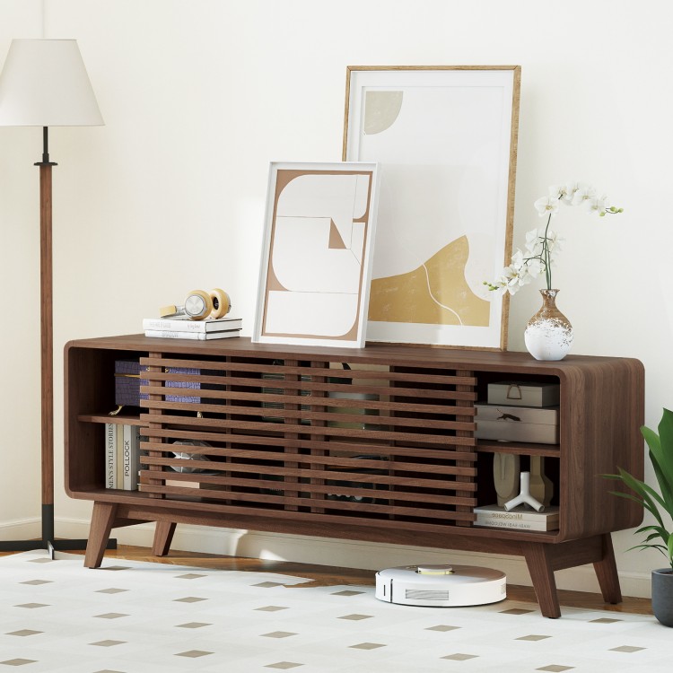Walnut TV stand with sliding doors, adjustable shelves, and splayed rubber wood legs, perfect for TVs up to 65".