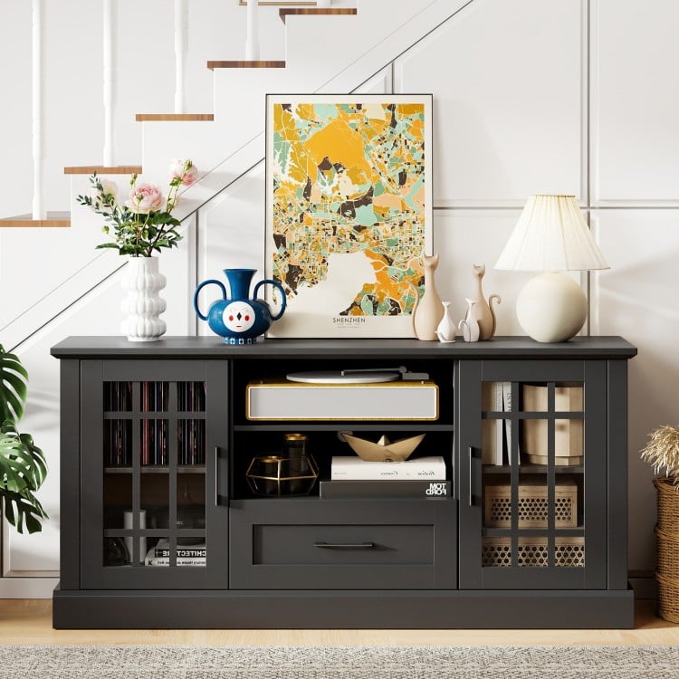 Black TV stand with glass doors, adjustable shelves, and drawer, perfect for TVs up to 70 inches in living rooms.