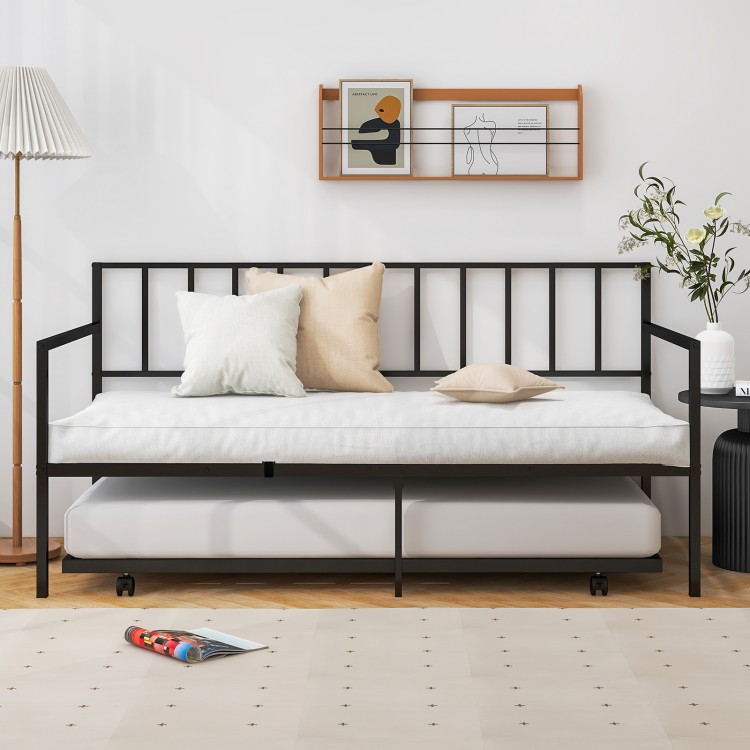 Twin size daybed and trundle frame set in black metal with cushions, ideal for living room or guest room use.
