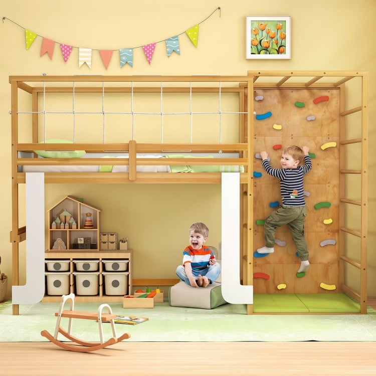 Twin bunk bed with jungle gym features a climbing ladder and rock wall, perfect for active play and sleep space.