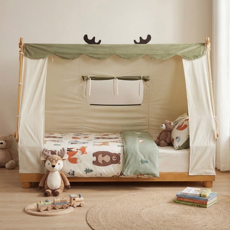 Twin size wooden bed with removable plush tent, antler theme, and protective side rails for a cozy children's sleep.