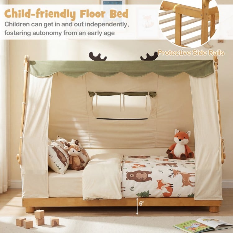 Twin size wooden floor bed with removable tent, protective side rails, and whimsical antler design for children's.