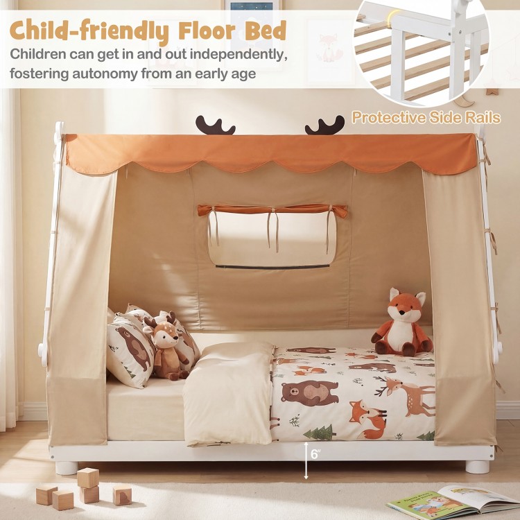 Twin size house floor bed with removable tent, protective side rails, and whimsical antler design for cozy children's.