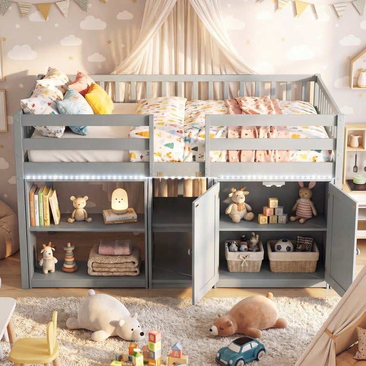 Twin size loft bed in gray with LED lights, featuring under-bed storage and shelves for toys and books in a kids' room.