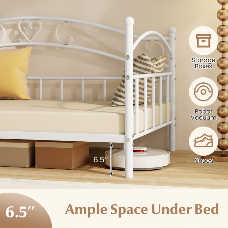 Twin size metal daybed frame in white with ample under-bed space for storage boxes and robot vacuum.