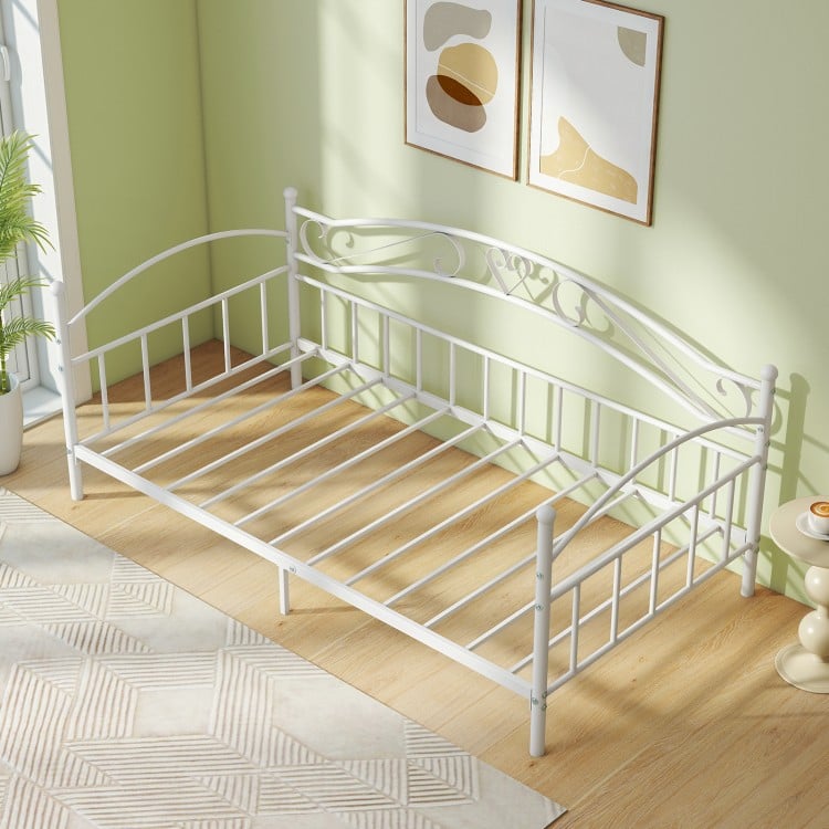 Twin size metal daybed frame in white with heart-shaped decoration, perfect for extra sleeping space and storage.