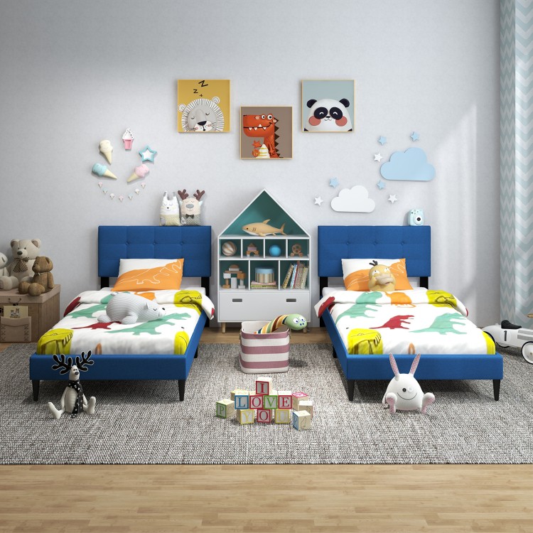 Twin size upholstered platform beds in blue with button tufted headboards, perfect for children's bedrooms or guest.