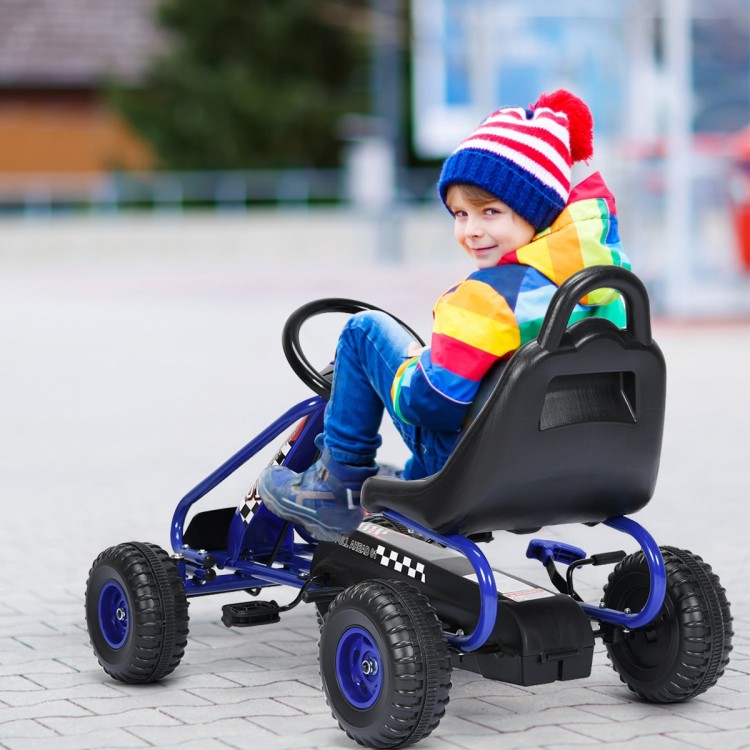 Child riding a blue pedal-powered go-kart with adjustable seat, featuring non-slip wheels and a handbrake for safety.