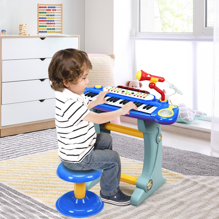 Child playing the 37 Key Electronic Keyboard Kids Toy Piano in blue, featuring a detachable microphone and stool.