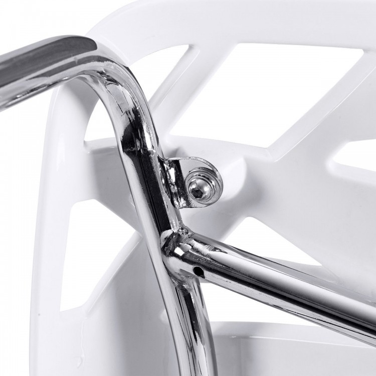 Close-up of the chrome frame of a modern accent chair with a cut-out tree design, ideal for indoor or outdoor use.