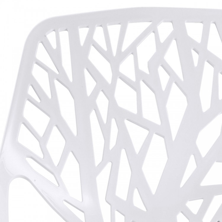 Close-up of a white plastic dining chair featuring a cut-out tree design, ideal for stylish indoor or outdoor use.