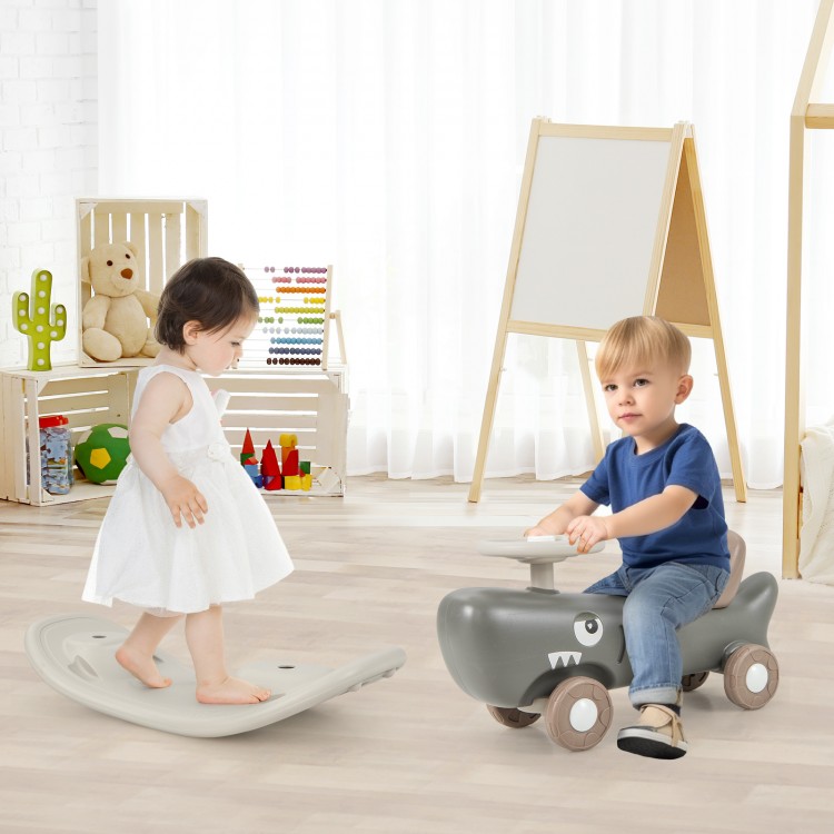 Convertible rocking horse and sliding car in dark gray, featuring a balance board for kids' motor skill development.