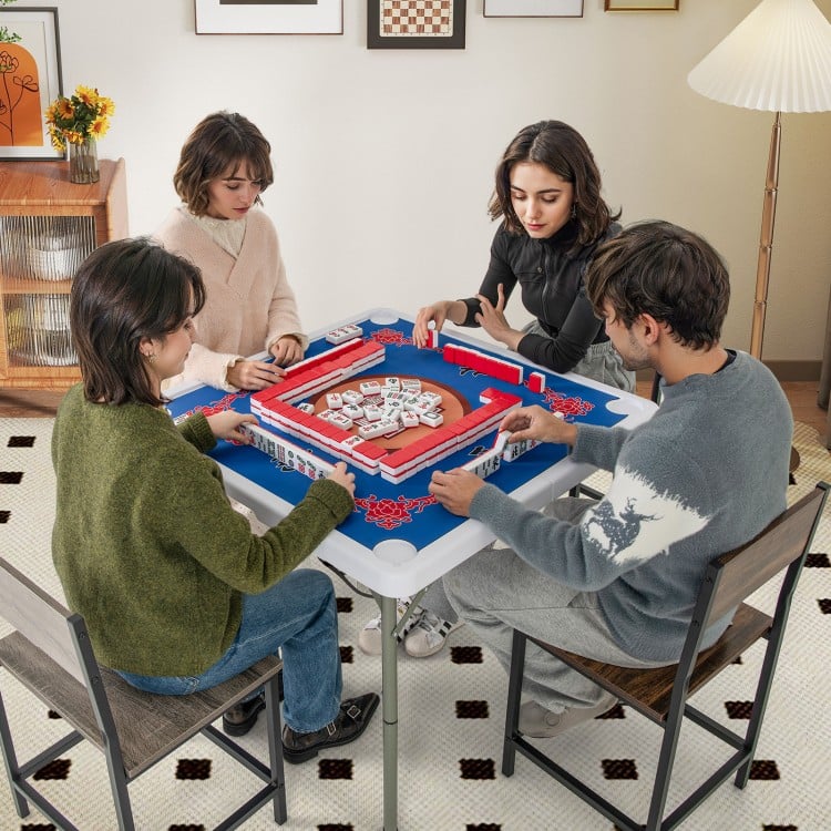 Four players enjoying a game at the 35-inch blue folding mahjong table with cup holders, featuring a smooth felt.