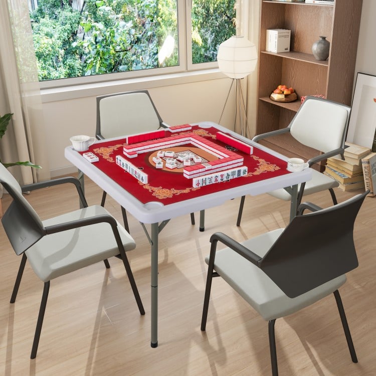 Folding 35-inch mahjong table with red felt surface, cup holders, and four chairs, ideal for home or outdoor games.