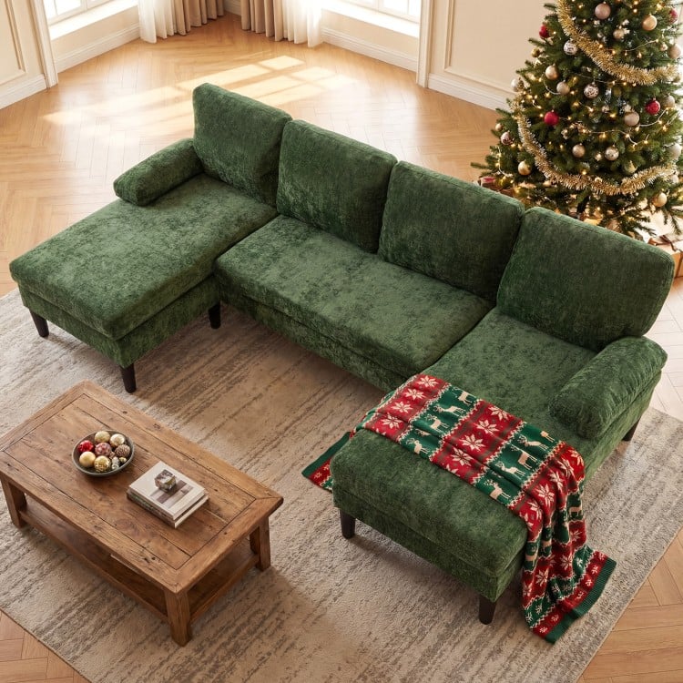 U-shaped green sectional couch with dual chaise, soft corduroy fabric, perfect for living room gatherings.