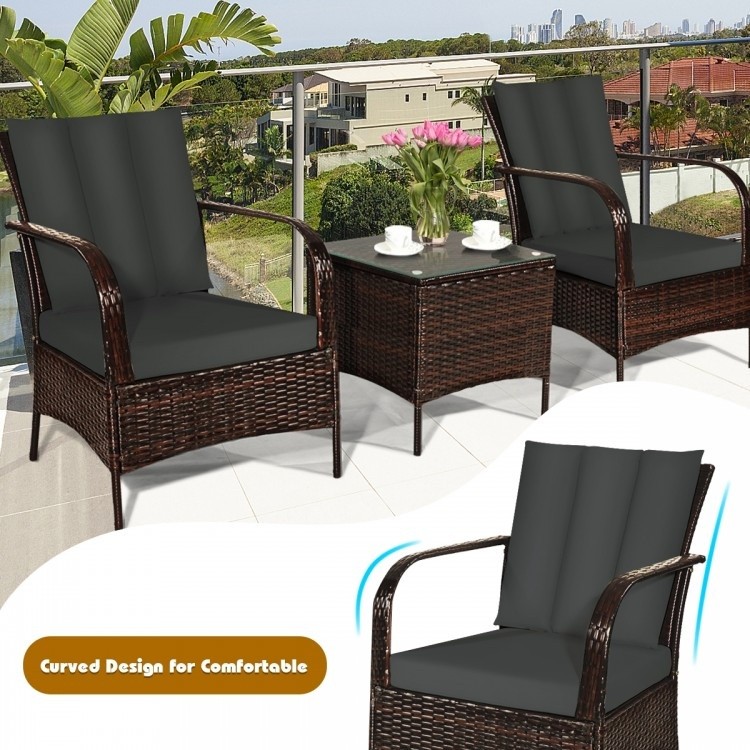 Curved design patio chair with gray cushions from the 6-piece rattan furniture set for outdoor relaxation.