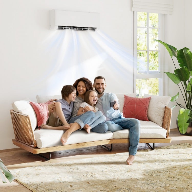 Family enjoying comfort on a stylish sofa with the Ultra-Quiet Inverter Mini Split AC for efficient cooling and heating.