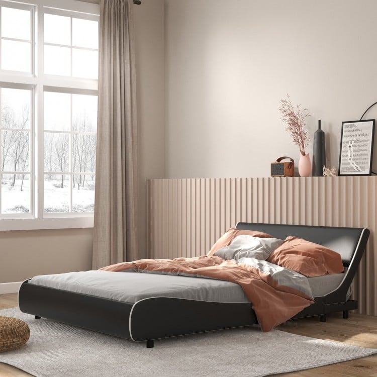 Full-size upholstered platform bed frame in faux leather with a curved headboard, designed for comfort and stability.