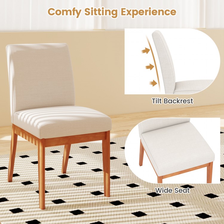 Beige upholstered dining chair with rubber wood legs, featuring a wide seat and tilt backrest for enhanced comfort.