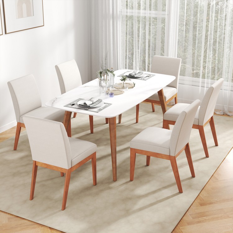 Beige upholstered dining chairs with rubber wood legs, featuring a cushioned seat and curved backrest for comfort.