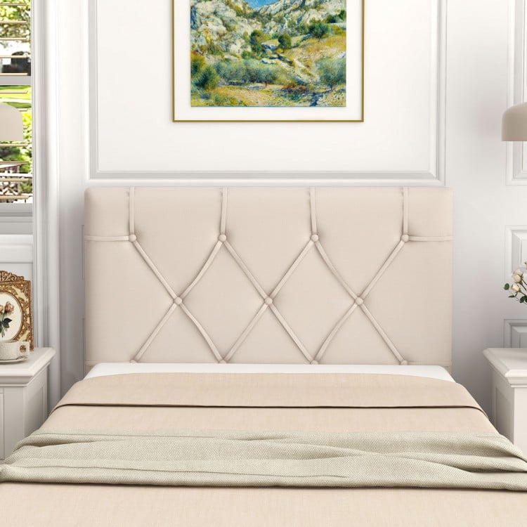 Beige upholstered headboard for twin bed showcasing a unique button tufted design, enhancing modern bedroom aesthetics.