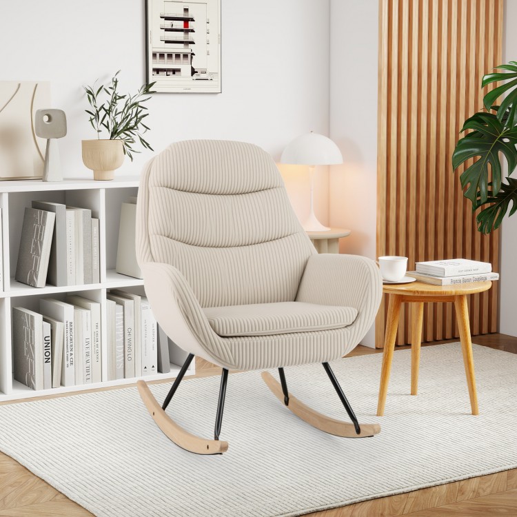 Beige upholstered rocking chair featuring a cozy padded seat and corduroy fabric, ideal for relaxation in any room.
