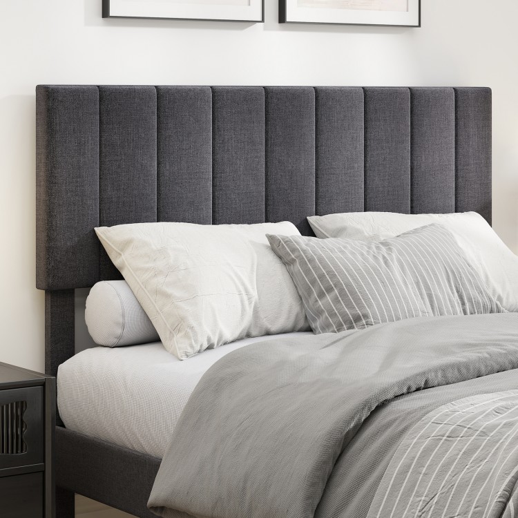 Full view of the velvet upholstered platform bed with height adjustable vertical channel headboard and gray bedding.