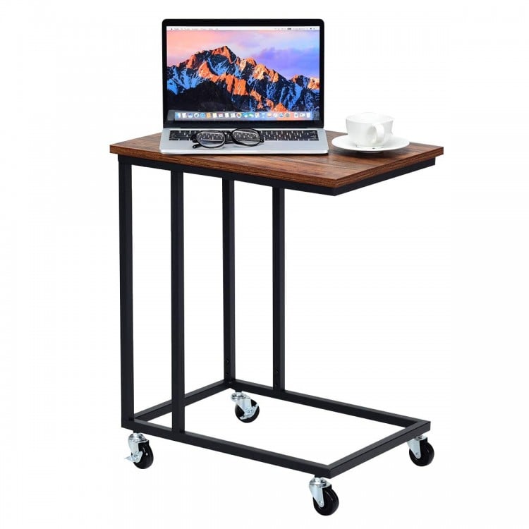 Mobile side table with a brown wood top and black metal frame, ideal for use beside a sofa or bed.