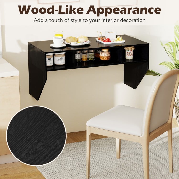 Wall-mounted computer desk in black with wood-like appearance, featuring three storage compartments for efficient.