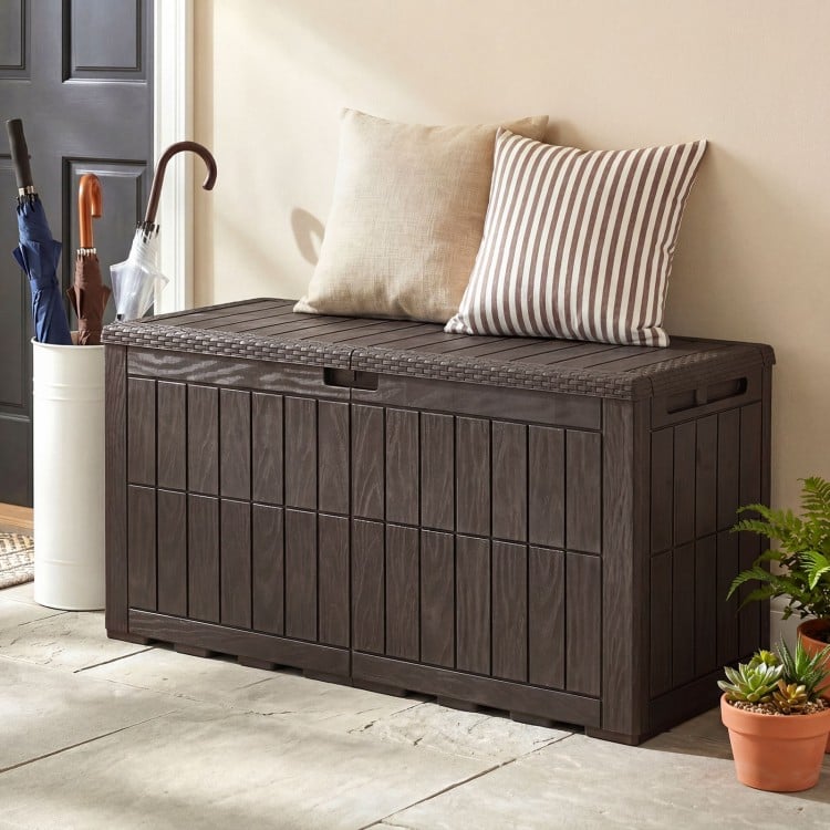 Dark brown waterproof lockable outdoor deck box with cushions, offering 120 Gal capacity for tools and seating for.