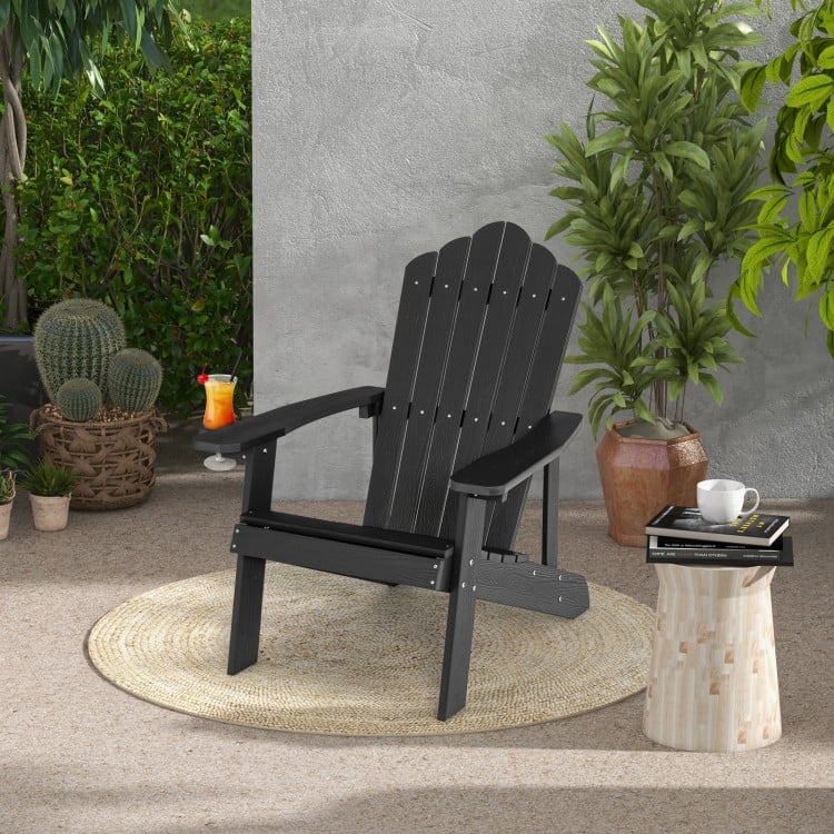 Black Weather Resistant HIPS Adirondack chair showcasing a high slanted backrest, ideal for garden and patio relaxation.