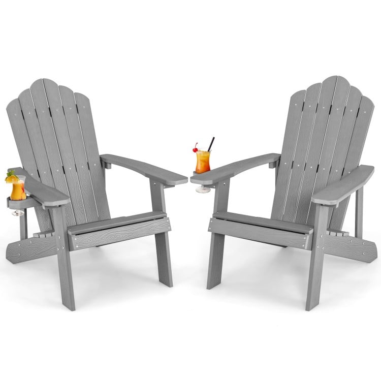 Two gray Weather Resistant HIPS Outdoor Adirondack Chairs with cup holders, perfect for relaxing on the patio or garden.