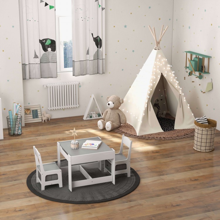 Kids table and chairs set in white with storage boxes, ideal for drawing and play in a children's room.