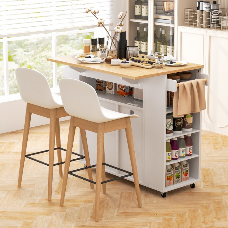 Rolling kitchen island cart in white and natural wood with ample storage, charging station, and drop leaf design for.