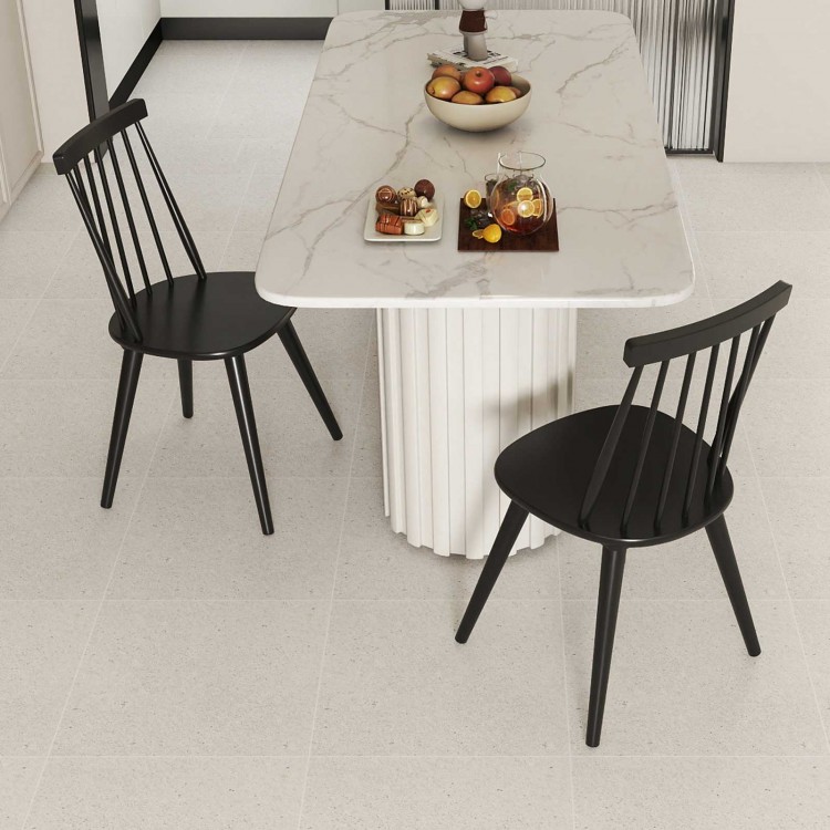 Black Windsor dining chairs with ergonomic spindle backrest, perfect for dining rooms or cafes, shown with a marble.