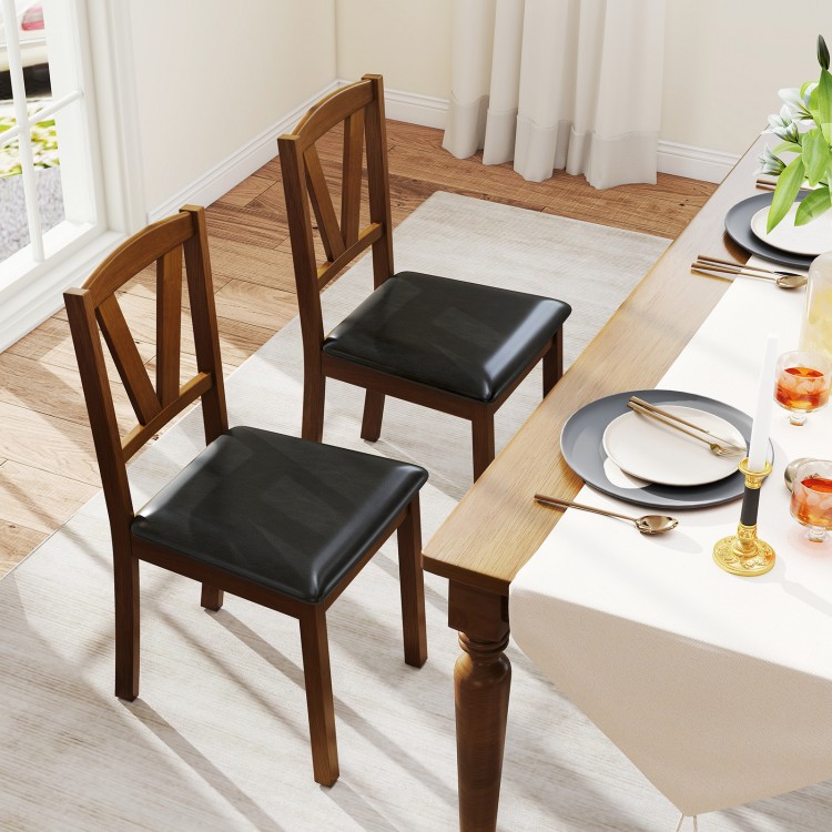 Set of 2 wooden dining chairs with brown rubber wood frame and black PU leather upholstery, perfect for dining areas.
